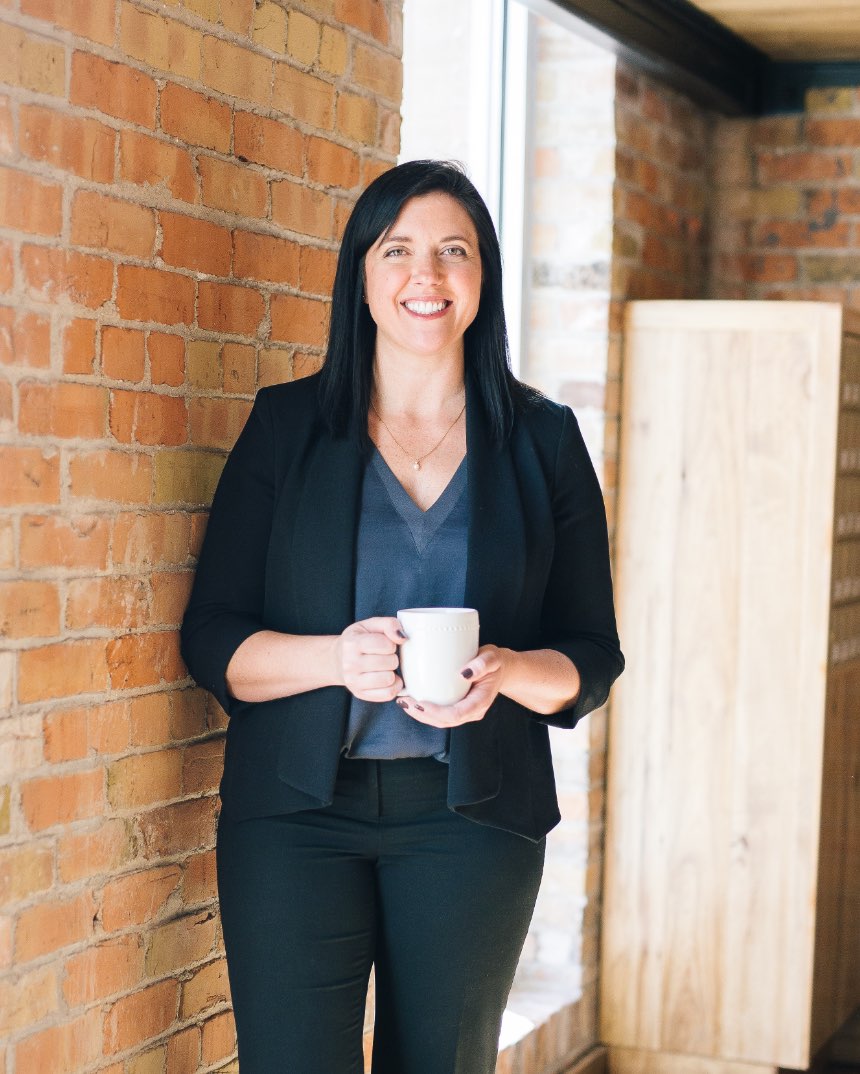 Lady smiling with cup of tea