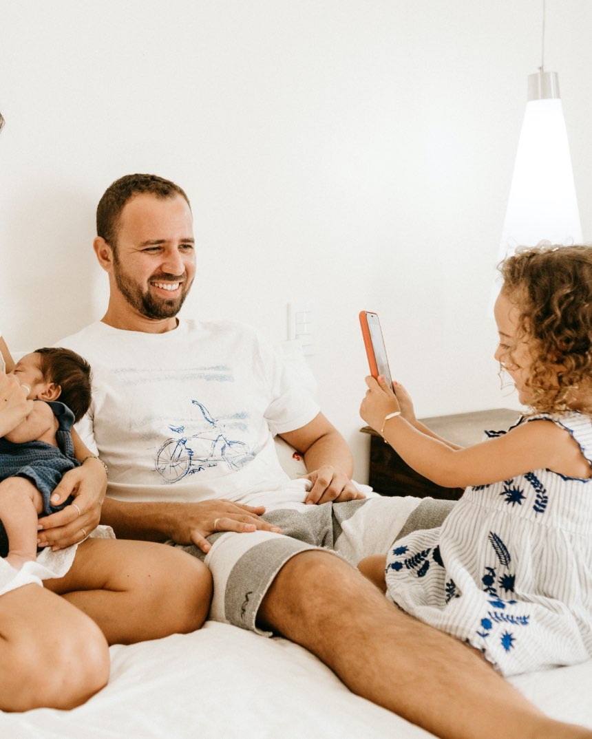 Man with children taking photo