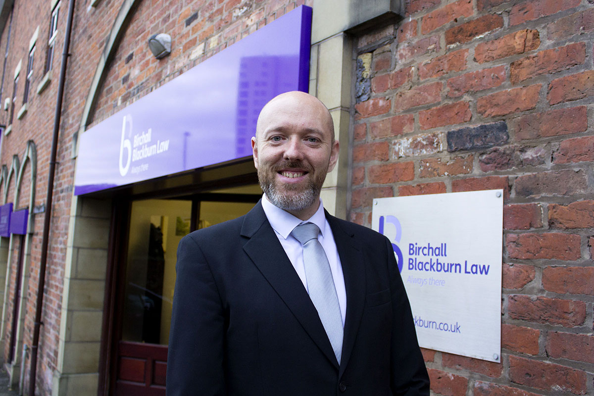 Solicitor Andrew Taylor outside Birchall Blackburn Law