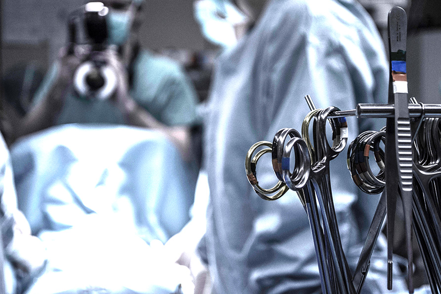 A close up of surgical scissors in an operating room