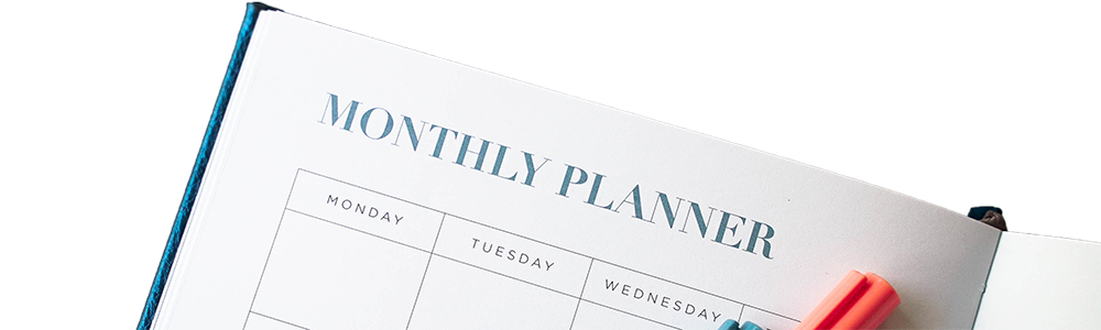 The top of a monthly planner calendar