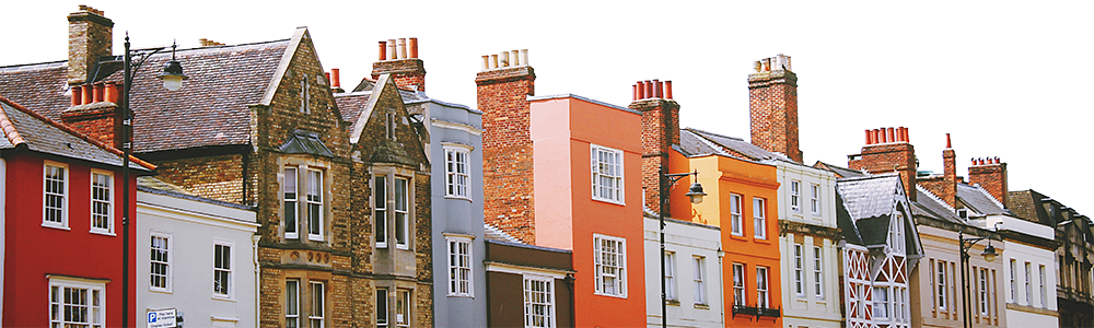 A view of the first, second and third floor of a row of houses of all different types and colours