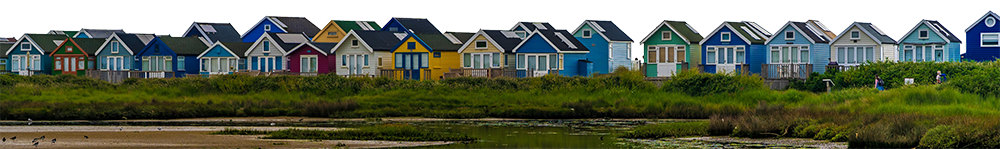 A row of multi-coloured waterside houses