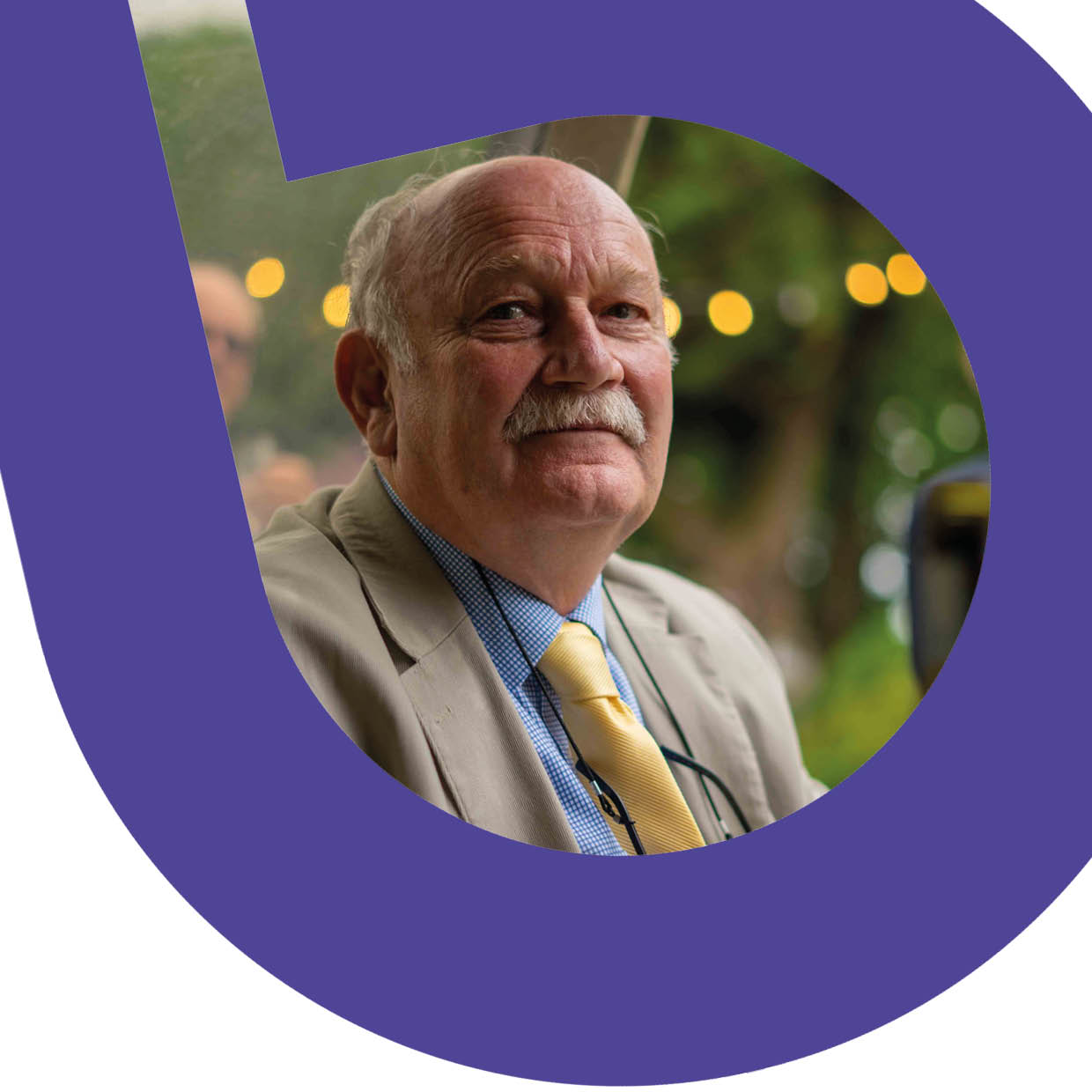 Older man with white moustache and yellow tie