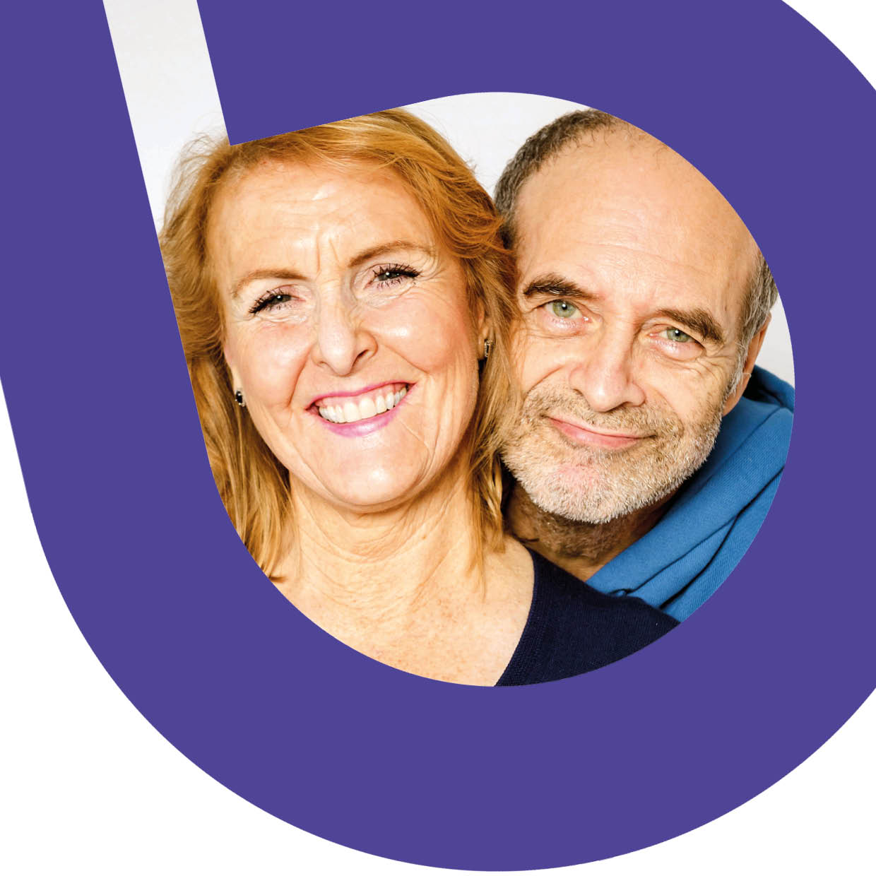 A middle-aged man and woman smiling